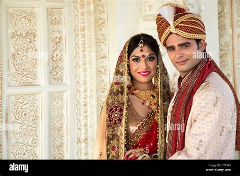 Indian Bride And Groom In Traditional Wedding Dress Stock Photo