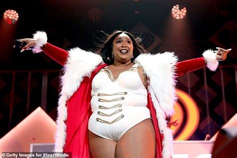 Lizzo Rocks White Bodysuit And Santa Style Red Coat As She Performs At