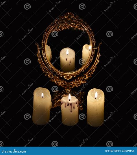 Mystic Still Life With Mirrow And Three Burning Candles Stock Photo