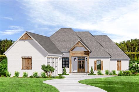 Acadian House Plan with 3-Car Courtyard Garage - 510057WDY ...