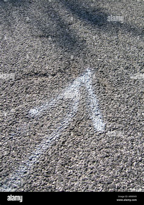 White Arrow Spray Painted On Road Stock Photo Alamy