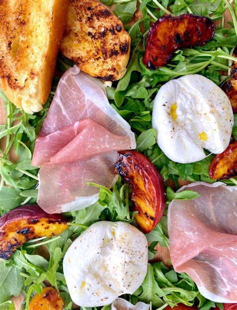 Grilled Peaches With Burrata Prosciutto On A Bed Of Baby Arugula