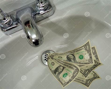 Money Going Down the Drain stock photo. Image of dollar - 107632796