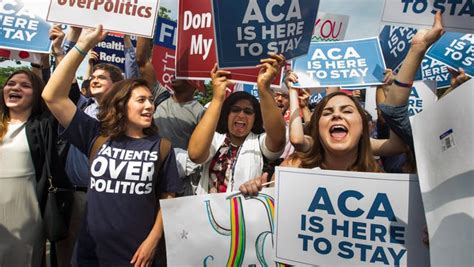 Supporters Of The Affordable Care Act Cheer After The Supreme Court Ruled That Obamacare Tax