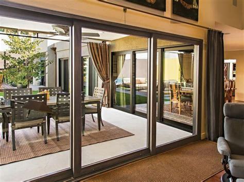 Large Black Sliding Glass Doors That Lead From The Inside Outside