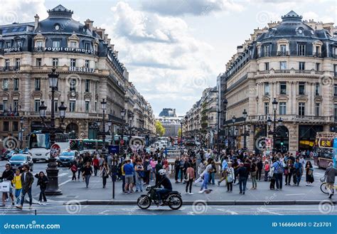 Street View Of Downtown With Historic Building And Lots Of People In