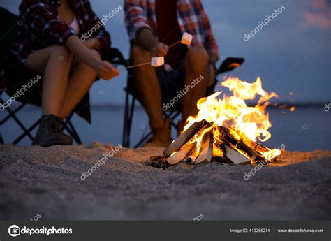 People Roasting Marshmallows Burning Firewood Beach Closeup Stock Photo