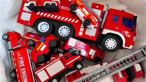 A Lot Of Fire Truck Toys Into A Box Collect Fire Engine Mini Cars In A