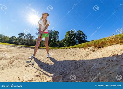 Lovely Blonde Female Golfter Enjoying A Round Of Golf On A Public Golf Course Stock Image