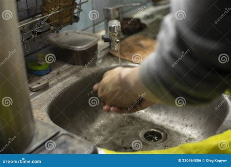 Hand Washing In The Sink The Bachelor Washes His Fingers With Soap