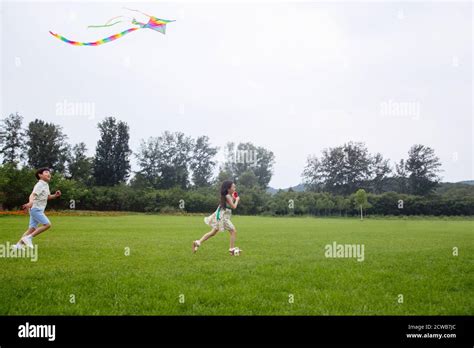 Children Flying Kites Hi Res Stock Photography And Images Alamy