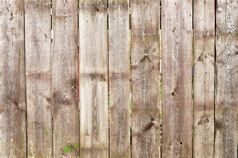 Brown Wooden Fence Background With Green Leaves Stock Photo Dissolve