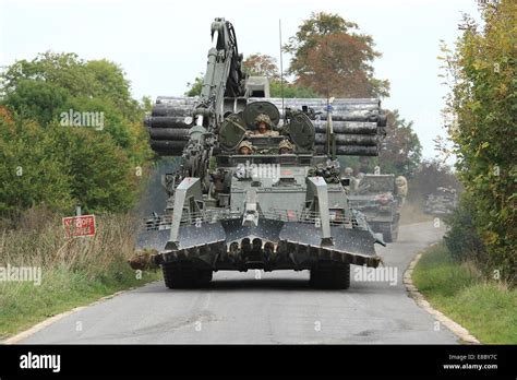 Trojan Armoured Vehicle Armoured Engineer Vehicle Leads A Convoy Of