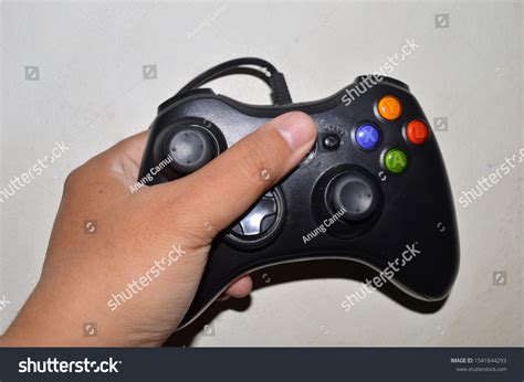 hand holding game controller joystick stock photo  shutterstock