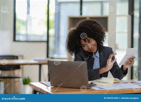 African American Businesswoman Working On Laptop At Office Using