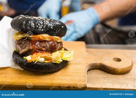 Gourmet Burger Served On Wooden Cutting Board Stock Photo Image Of