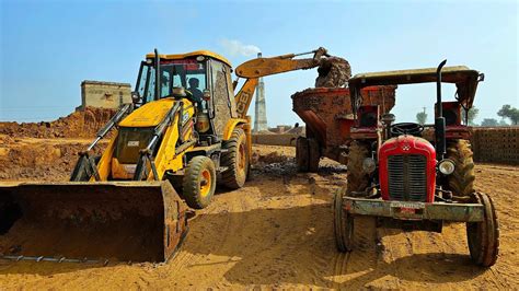 Jcb Dx Eco Machine Loading Mud In Massey Tractors And Hopper I Jcb