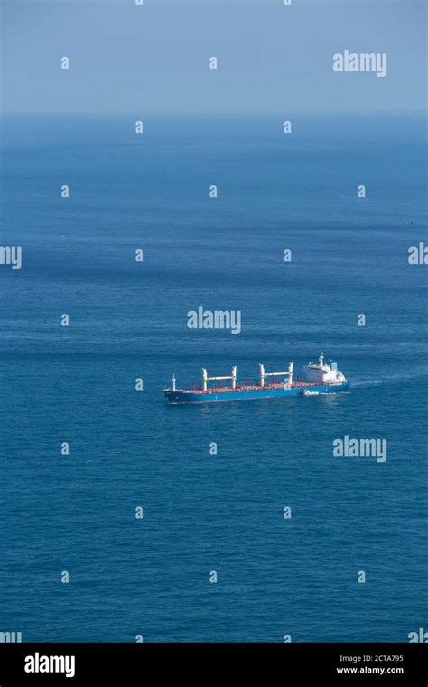 England Gibraltar Cargo Ship With Pilot Boat Stock Photo Alamy