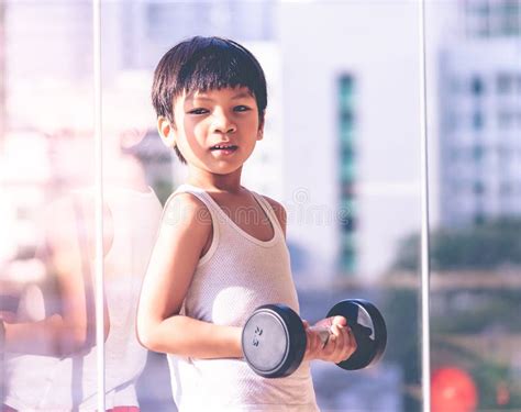 Boy Working Out with Dumbbells in a Gym Stock Image - Image of child ...