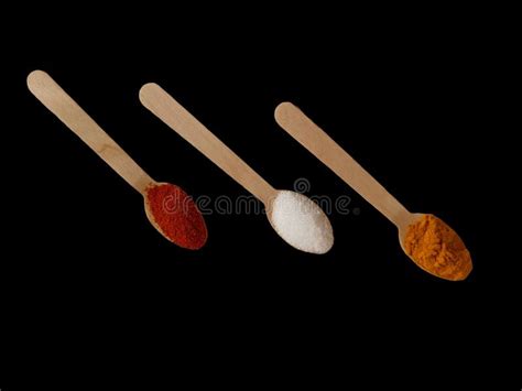 Various Asian Spices In Spoon On Black Background Stock Illustration