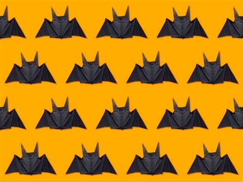 Premium Photo | Halloween concept. stripes of paper bats using origami technique