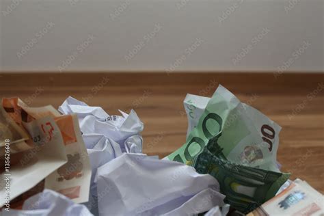 Geld Im M Ll Stock Photo Adobe Stock