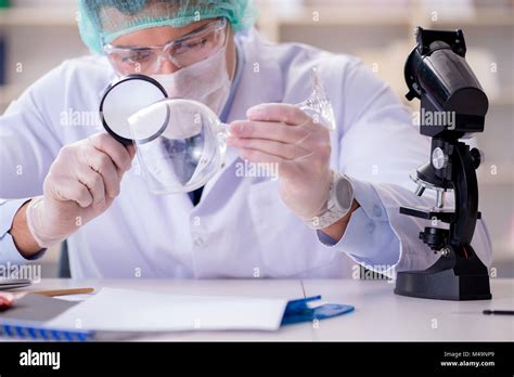 Forensics Investigator Working In Lab On Crime Evidence Stock Photo Alamy