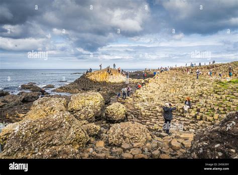 Bushmills Northern Ireland Aug 2019 Tourists Sightseeing Hexagonal Rock Formation In Giants