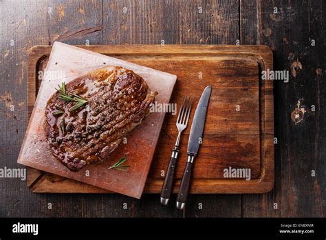 Grilled Black Angus Steak Ribeye On Himalayan Pink Salt Block On Dark