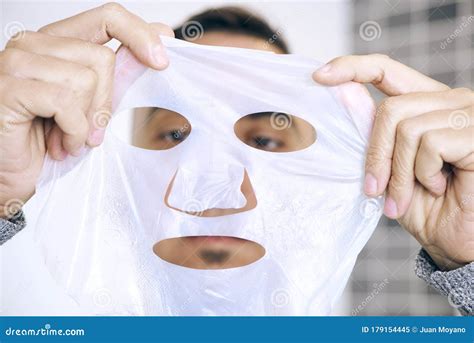 Man About To Apply A Facial Mask To Himself Stock Image Image Of