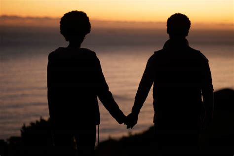 170 Couple Holding Hands Sunset Dark Stock Photos Pictures And Royalty