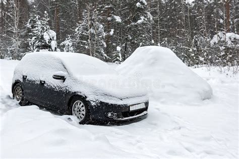 Black Dirty Car Under The Snow In Forest Heavy Snowfall Frozen Car In