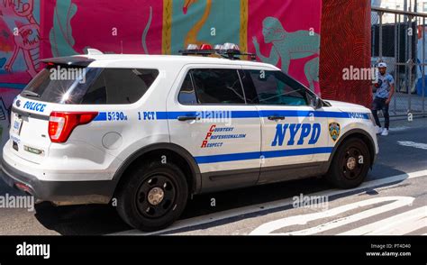 An Nypd Police Patrol Car Parked On A Very Sunny Day On The Streets Of