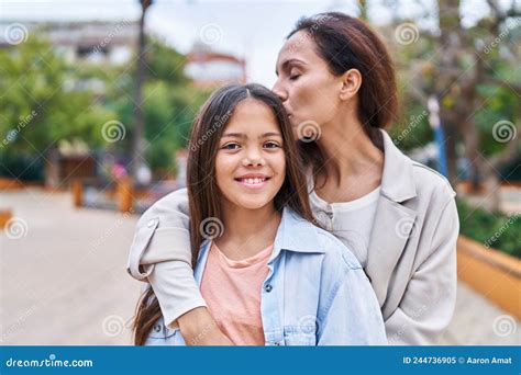 Woman And Girl Mother And Daughter Hugging Each Other And Kissing At Park Stock Image Image Of