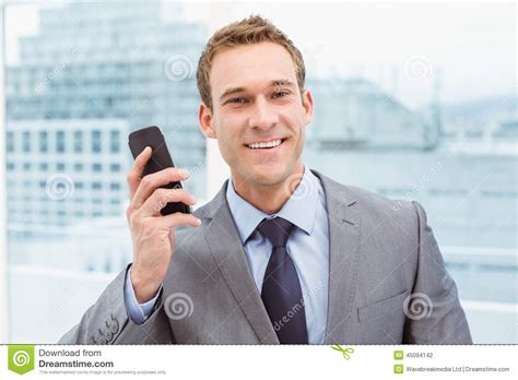 Portrait Of Businessman Using Mobile Phone Stock Photo Image Of Suit