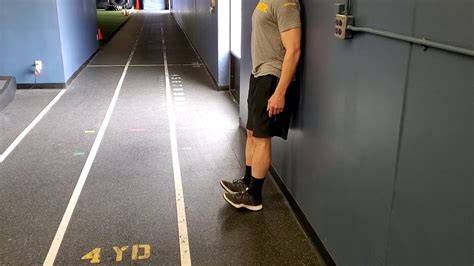 Standing Dorsiflexion With Wall Lean Youtube