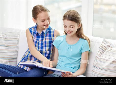 Two Girls Reading Book Hi Res Stock Photography And Images Alamy