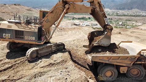 Caterpillar 5130b Loading 777fs On Large Housing Project In Socal