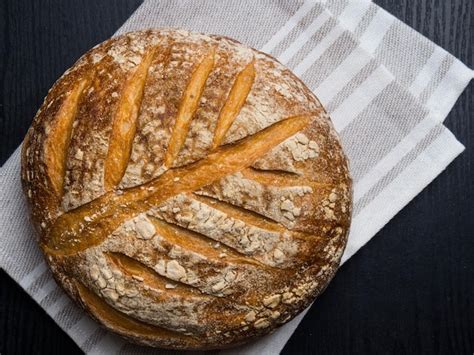 Premium Photo Freshly Baked Traditional Bread On Wooden Table