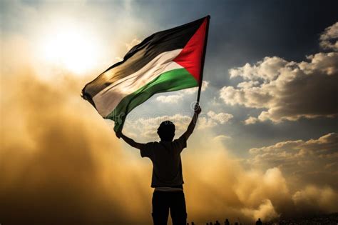 Happy Man Holding Palestine Flag In The Sunset Sky Freedom And