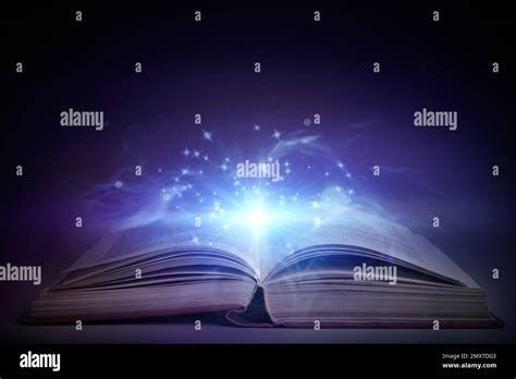 Open Book With Magic Glowing On Table Fairy Tale Stock Photo Alamy