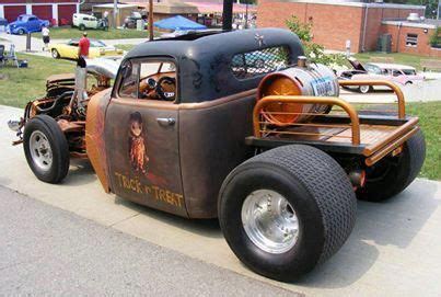 an old model truck is parked on the side of the road