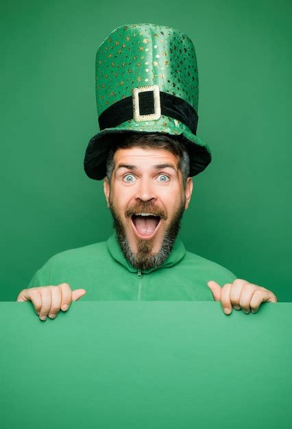 Premium Photo Man In Saint Patricks Day Leprechaun Party Hat Having