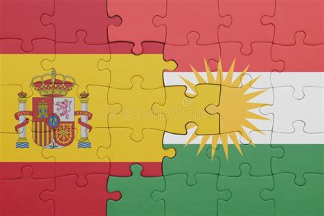 Puzzle With The Colourful National Flag Of Kurdistan And Flag Of Spain