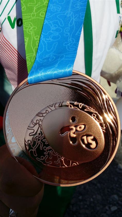 Medalla de Bronce de Tiradora Marina Nava Oficial del Comité Olímpico