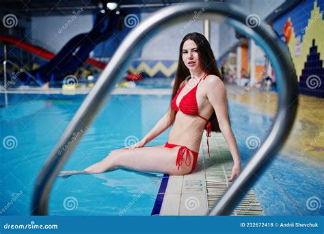 Brunette Girl In Red Swimsuit Having Rest In Swimming Pool Of Aqua Park Stock Photo Image Of