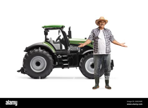 Full Length Portrait Of A Mature Farmer Showing With Hands In Front Of