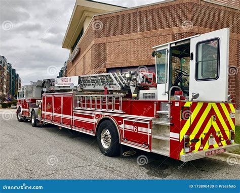 Firefighter With A Long Ladder With The Oxygen Cylinder Enters T