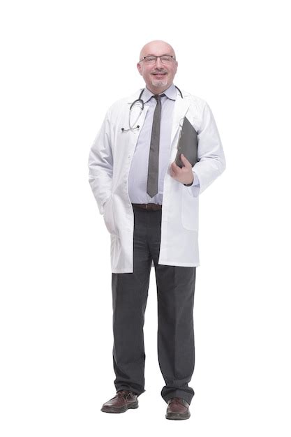 Premium Photo Mature Doctor With Clipboard Isolated On A White Background