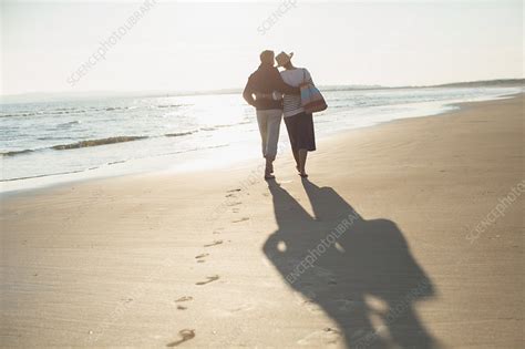 Affectionate Mature Couple Hugging And Walking Stock Image F019
